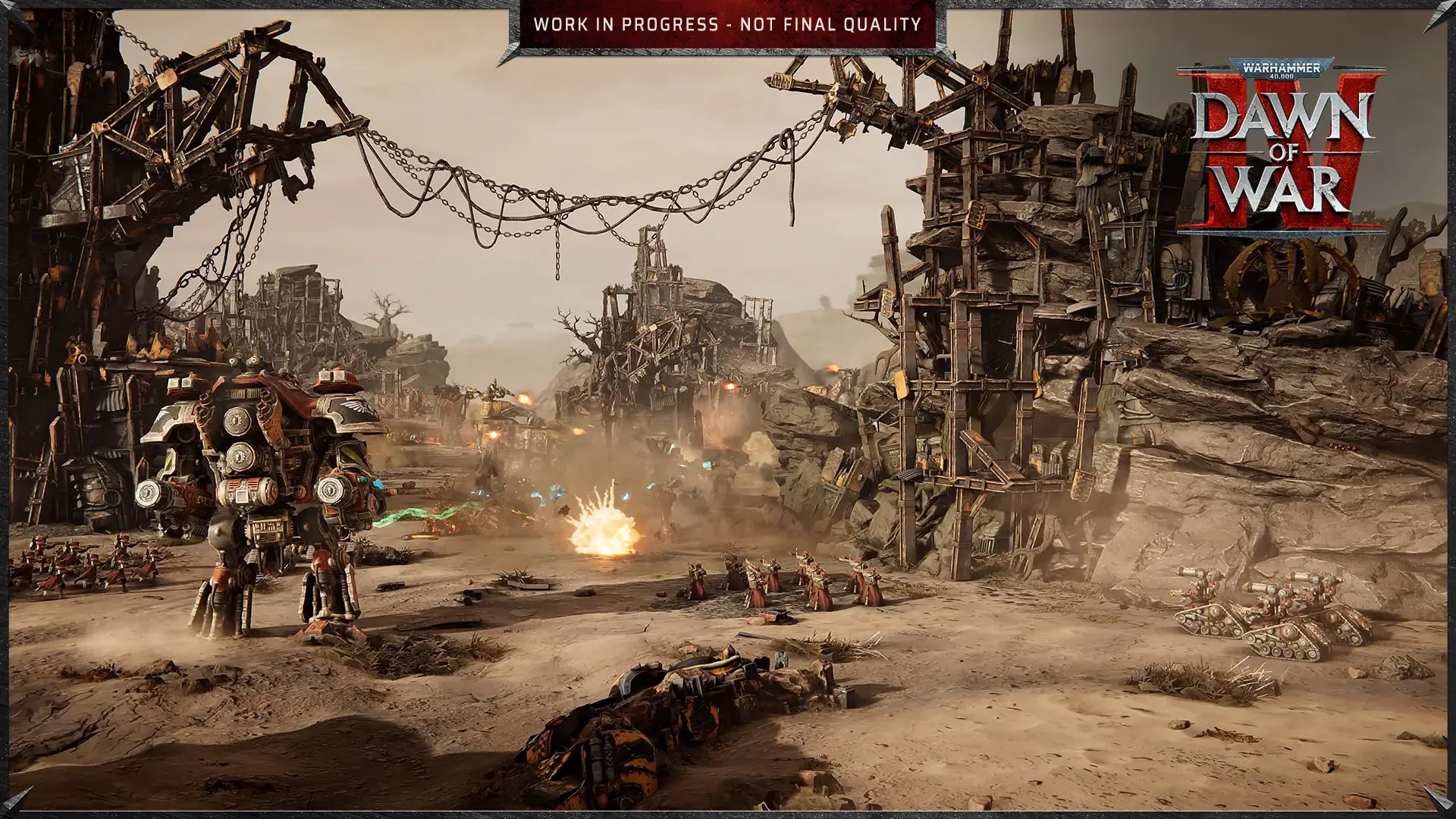 Official Warhammer 40,000: Dawn of War IV screenshot: a dusty ruined industrial site of tall scaffolds, with a walker advancing at the left.